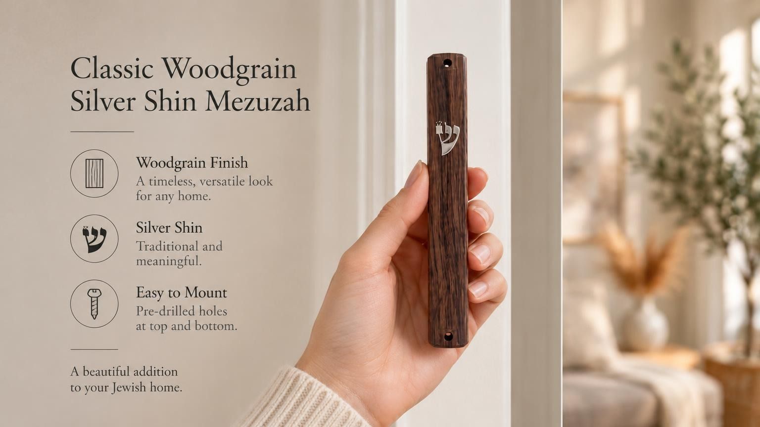 A hand holds a classic woodgrain acrylic mezuzah case featuring a silver Hebrew Shin on a bright, minimalist background.
