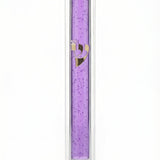 Transparent purple Lucite Mezuzah with Hebrew lettering, displayed upright against a white background with soft reflection.