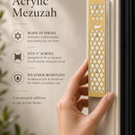 Person holding the gold acrylic mezuzah, highlighting its detailed star of david design and Hebrew Shin.