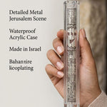 Close-up of the Clear Jerusalem Silver Plaque Lucite Mezuzah held in hands, highlighting its craftsmanship and detailed design.