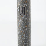 Colorful cement Mezuzah case with modern design and durable finish, mounted on a clean white background with a soft reflection below.