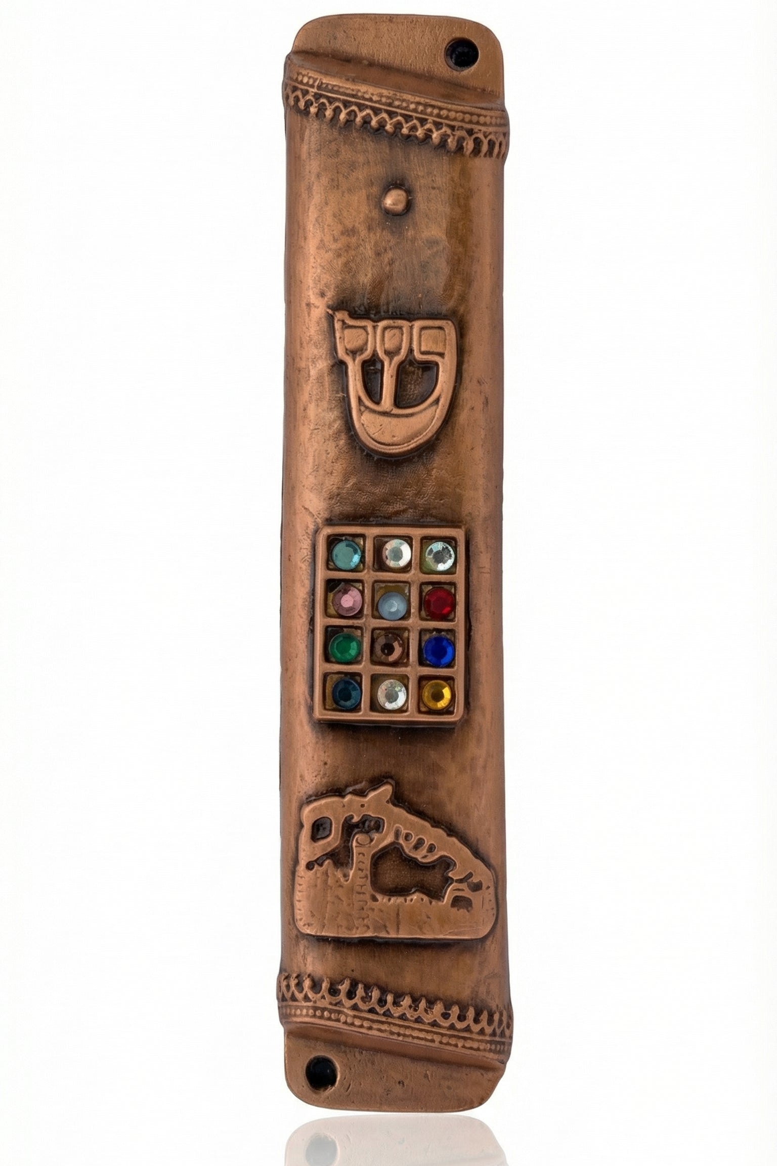 Copper Mezuzah made in the USA, measuring 6.5 inches tall by 1.1 inches wide, with fine engraved Hebrew letters, decorative motifs, and a polished finish.