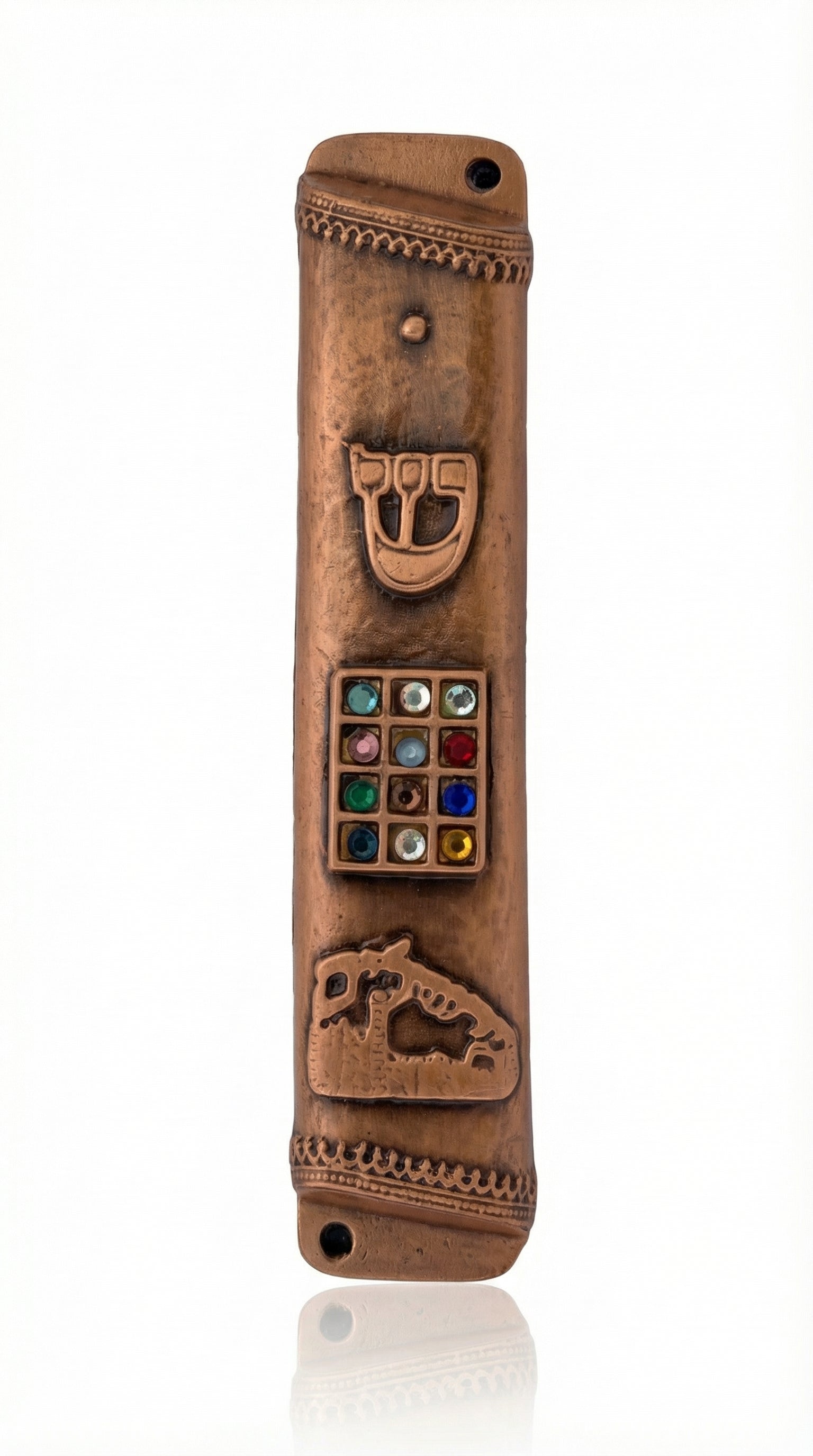 Copper Mezuzah made in the USA, measuring 6.5 inches tall by 1.1 inches wide, with fine engraved Hebrew letters, decorative motifs, and a polished finish.