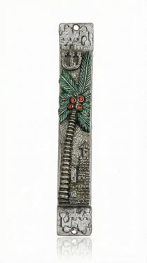 Detailed view of a handcrafted pewter mezuzah with colorful enamel accents, mounted on a white background with soft studio reflection.