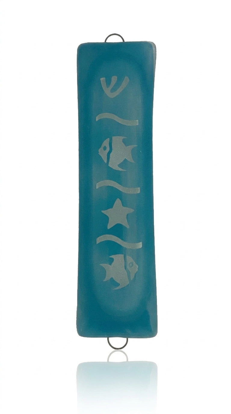 Deep Sea Glass Mezuzah with intricate details, Hebrew inscriptions, and decorative motifs, displayed on a white studio background with soft reflection.