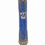 Elegant pewter mezuzah with modern blue enamel design, size 5.5 inches, on a white studio surface with subtle reflection, detailed craftsmanship.