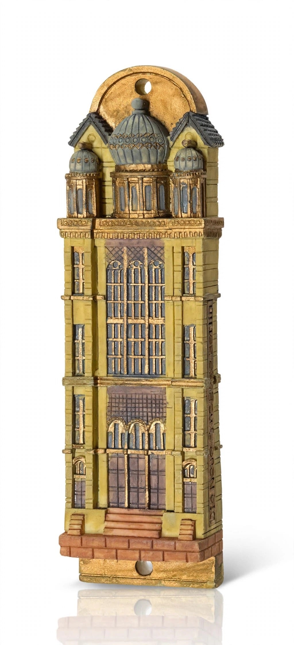 Die Neue Synagoge Berlin Mezuzah shown from the front as a mezuzah cover featuring golden ochre Fimo polymer clay shaped as the Berlin synagogue facade, with gray domes, tall windows and fine architectural relief, presenting a detailed Judaica design for a Jewish home doorway