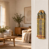 Die Neue Synagoge Berlin Mezuzah mounted vertically on a pale home doorpost, with golden ochre Fimo polymer clay shaped as the Berlin synagogue facade, with gray domes, tall windows and fine architectural relief creating a distinctive mezuzah cover that brings its Jewish design and decorative detail into the doorway