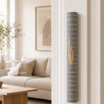 Yerushalayim gray stone mezuzah mounted on a doorpost, seen on approach to the entrance.