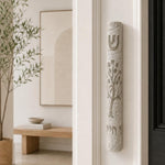 Etz Chaim gray stone mezuzah mounted on the right doorpost of an indoor doorway.