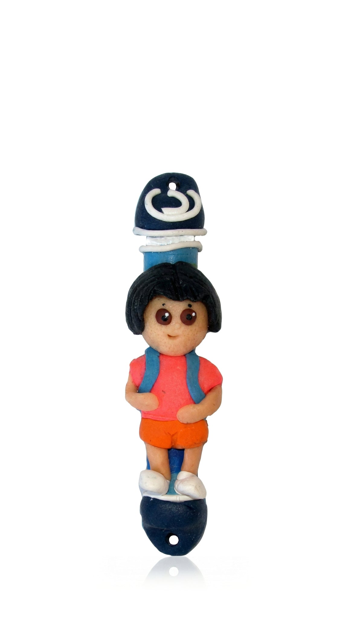 Dora the Explorer children’s mezuzah cover with a hand-modeled character in a pink top, orange shorts and white shoes, framed by dark blue caps and a white Hebrew Shin for a playful Fimo Judaica accent on a kid’s bedroom doorway