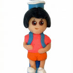 Adorable Dora the Explorer children's Mezuzah made in Israel, featuring detailed design and Hebrew inscriptions, mounted on a white background.