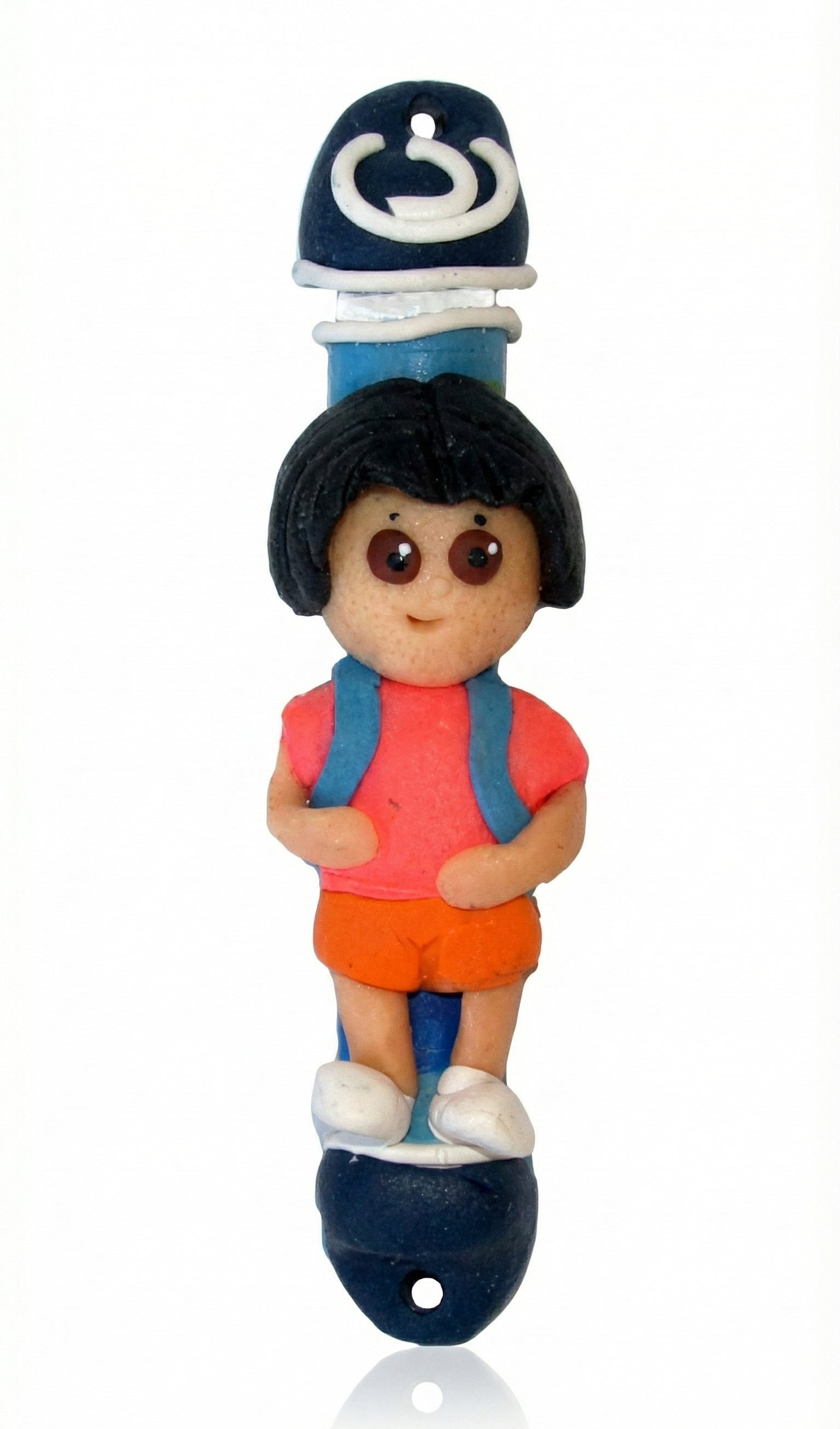 Adorable Dora the Explorer children's Mezuzah made in Israel, featuring detailed design and Hebrew inscriptions, mounted on a white background.