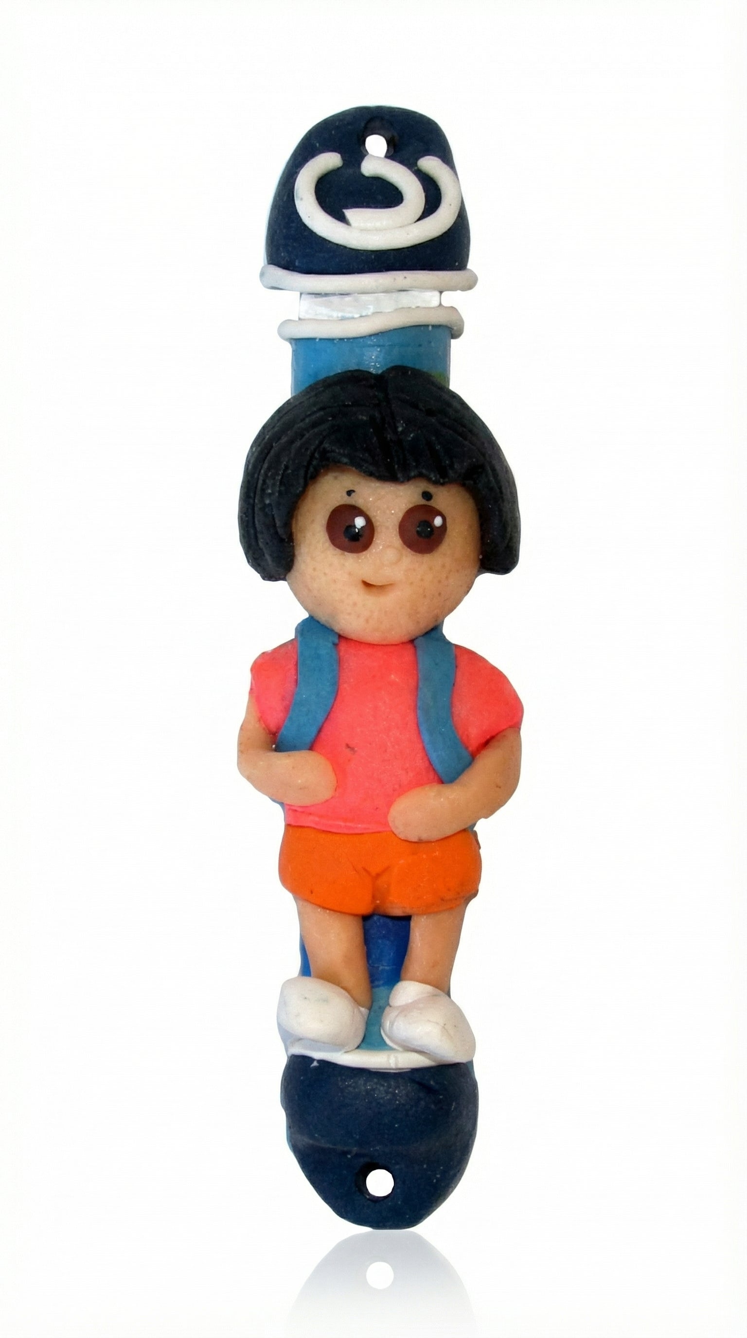 Adorable Dora the Explorer children's Mezuzah made in Israel, featuring detailed design and Hebrew inscriptions, mounted on a white background.