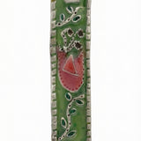 Upscale, high-resolution image of the Eden Mezuzah made of pewter with enamel painting, showing fine details, Hebrew inscriptions, and decorations.