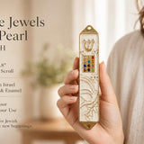 Pearl enamel mezuzah case with gold trim and dove design, featuring floral accents and twelve jewel-like colors, suitable for Jewish home entryways.