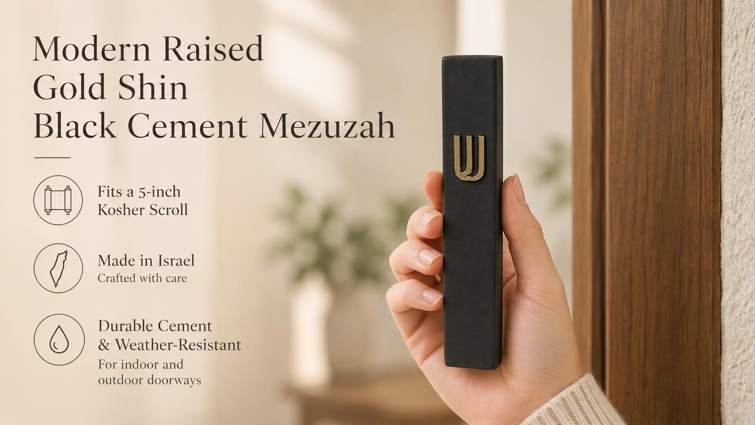 Close up of a hand holding a six-inch black cement mezuzah case with a prominent gold Hebrew Shin character