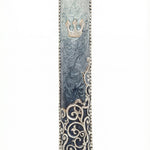 Elegant pewter mezuzah hand painted with enamel, measuring 5 inches tall, with intricate swirl details and Hebrew inscription, on a white studio background with soft reflection.