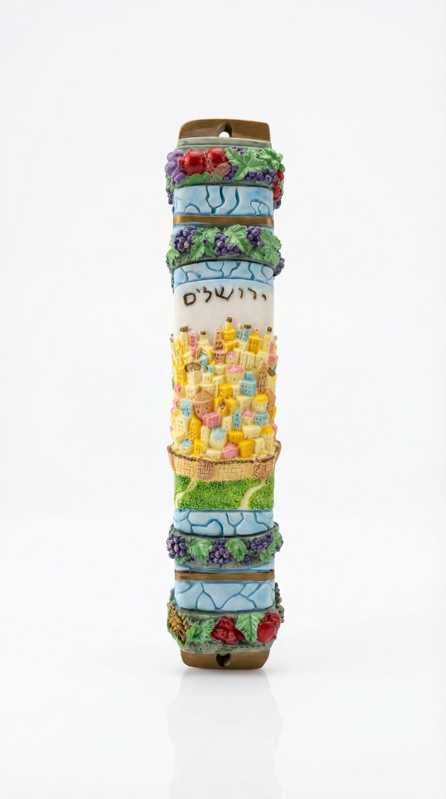 Detailed wooden mezuzah with Hebrew inscriptions and decorative motifs on a white background with soft reflection.