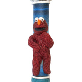 Elmo plush toy Mezuzah for children's room decoration, made in Israel, 4 inches tall with Hebrew inscription, on a white background.