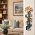 Mounting of the Enamel Tree of Life Mezuzah on a residential doorpost in an indoor setting, showcasing its vibrant colors and detailed design.
