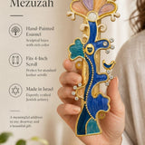 Person holding the brass made unique enamel Tree of Life mezuzah showing craftsmanship and vibrant crystal details