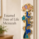 Enamel Tree of Life Mezuzah made of sculpted brass with colorful enamel, crystal accents, Hebrew shin, mounted on a neutral background.