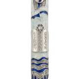 Encircling Tallit Mezuzah with blue enamel shades, sparkling accents, and a shining sequin at the center of a Magen David on a bright white background.