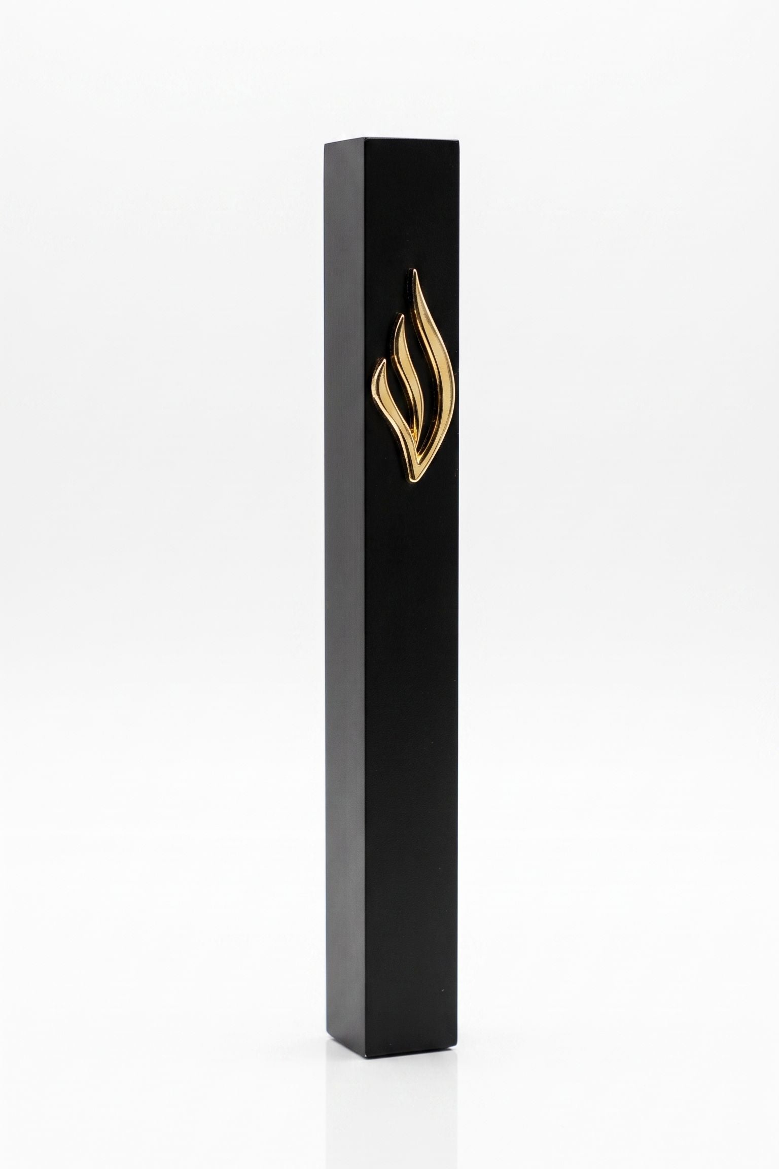 Slim black aluminum mezuzah made in Israel with a raised polished gold eternal-flame emblem on the front