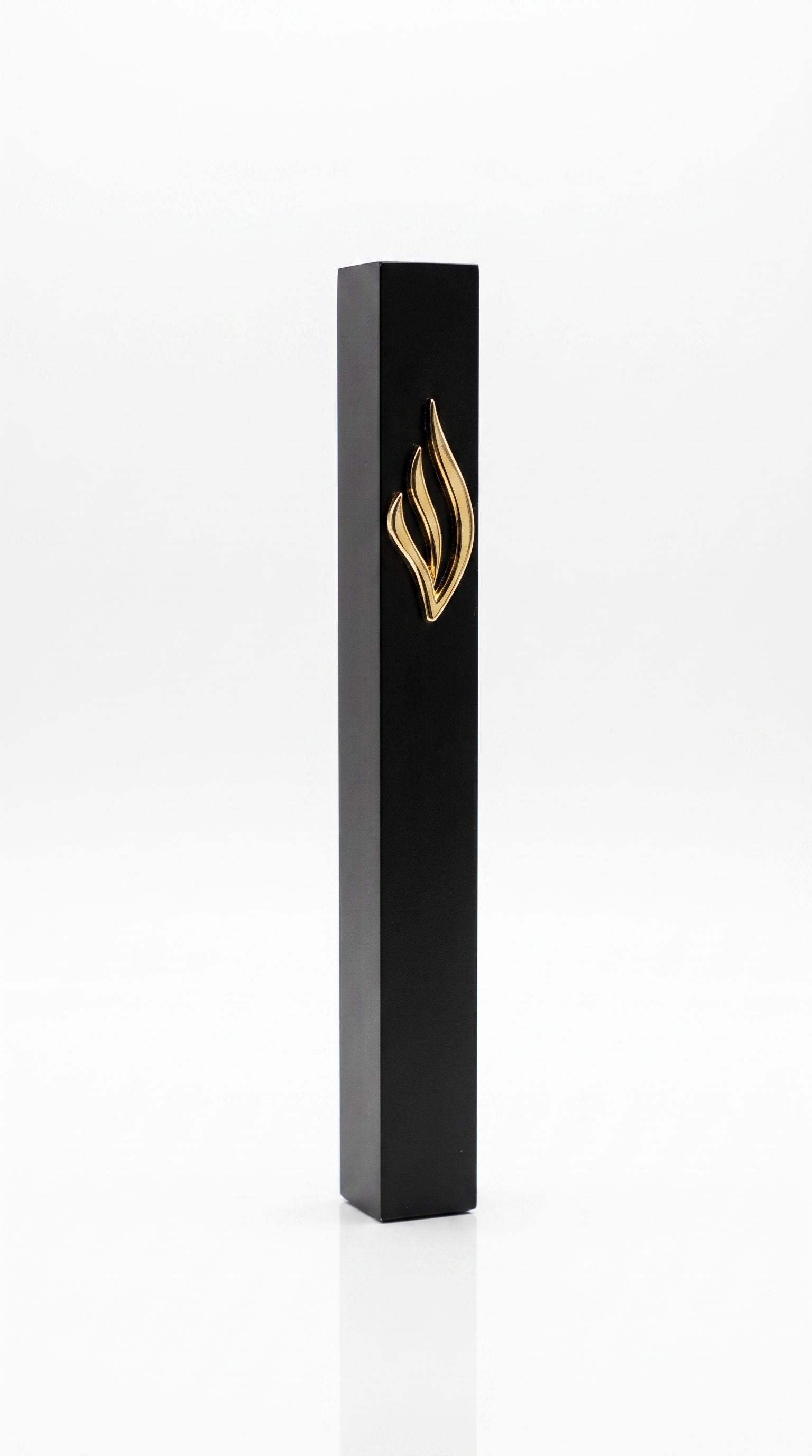 Slim black aluminum mezuzah made in Israel with a raised polished gold eternal-flame emblem on the front