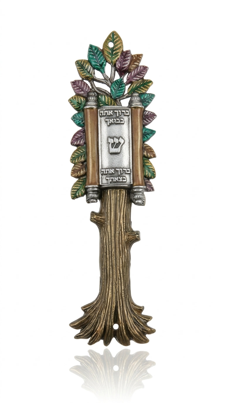 Elegant Torah-shaped Mezuzah with open scroll and blessing inscription, displayed on a white studio background with soft reflection.