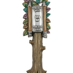 Elegant Torah-shaped Mezuzah with open scroll and blessing inscription, displayed on a white studio background with soft reflection.