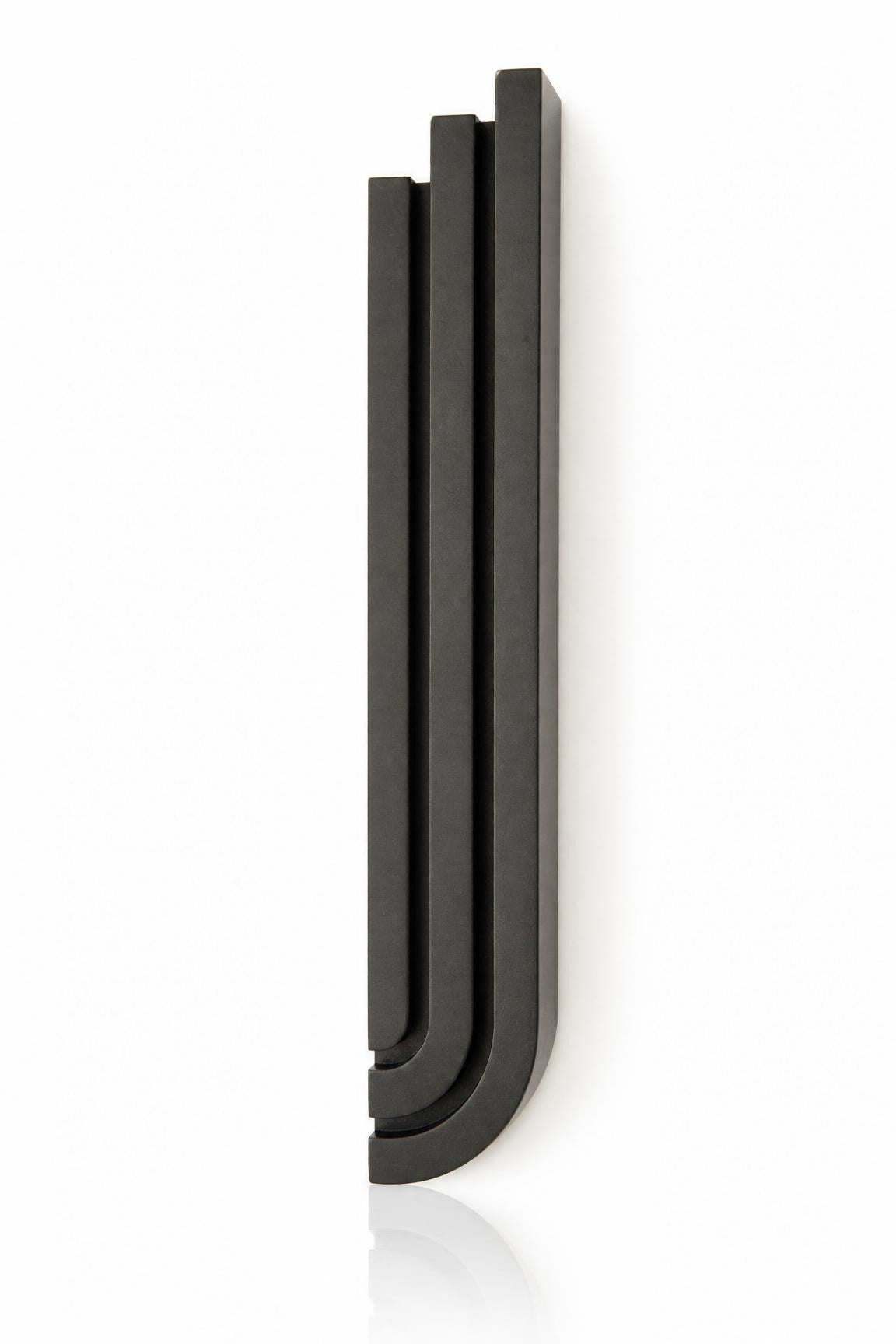 Precise mezuzah centered on pure white background, showcasing its full shape, depth, and hardware details.