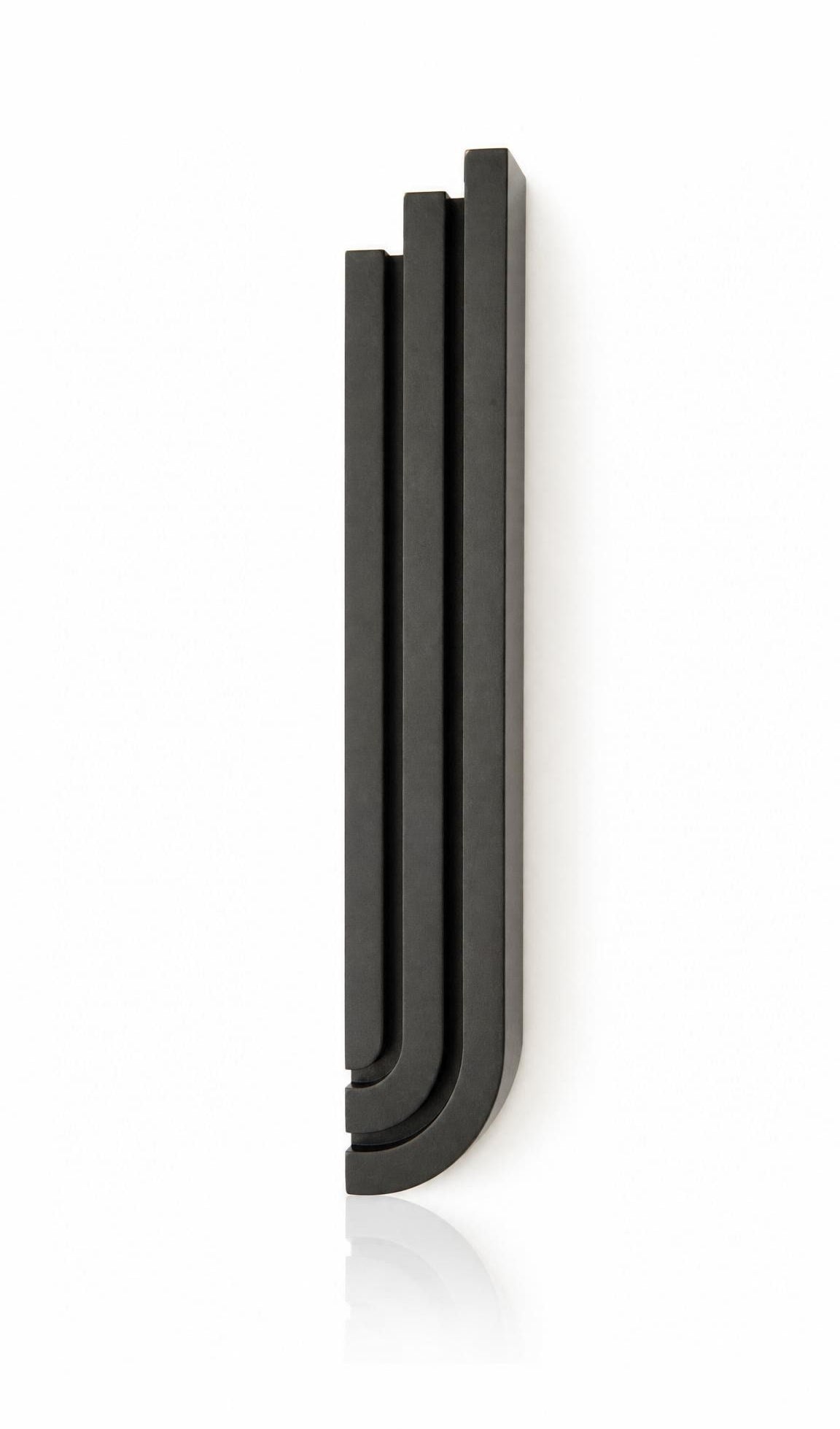 Precise mezuzah centered on pure white background, showcasing its full shape, depth, and hardware details.
