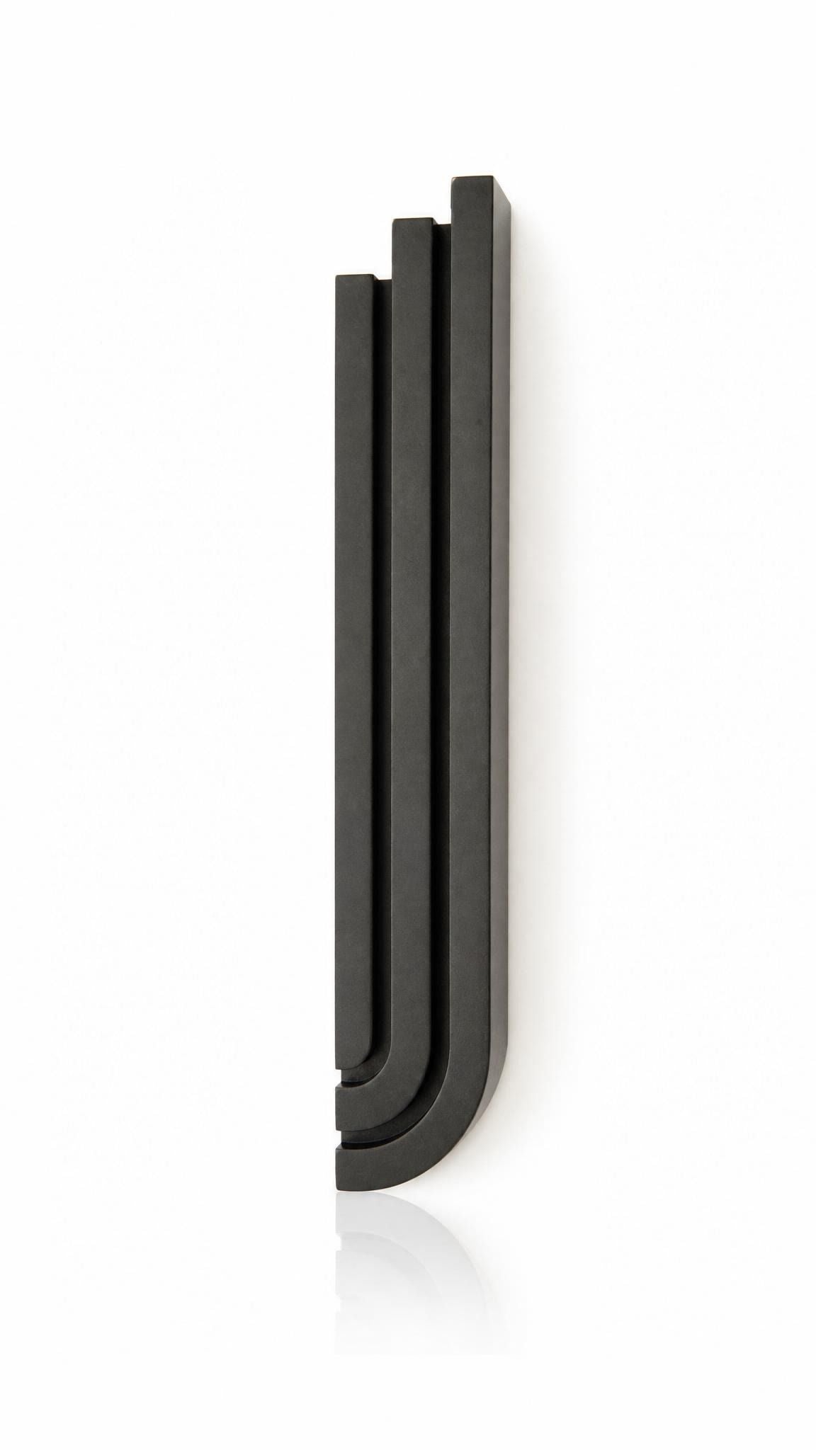 Precise mezuzah centered on pure white background, showcasing its full shape, depth, and hardware details.