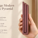 Extra Large Modern Burgundy Pyramid Mezuzah pictured in hand as a muted burgundy wine-red aluminum mezuzah cover with three graduated bars and a minimalist stepped design, alongside its name and illustrated product features in a wide social-sharing image
