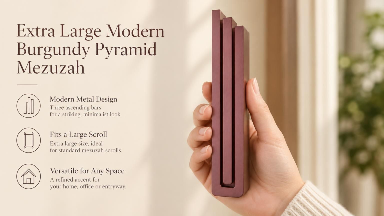 Extra Large Modern Burgundy Pyramid Mezuzah pictured in hand as a muted burgundy wine-red aluminum mezuzah cover with three graduated bars and a minimalist stepped design, alongside its name and illustrated product features in a wide social-sharing image