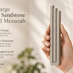 Extra Large Modern Sandstone Pyramid Mezuzah pictured in hand as a warm taupe sandstone aluminum mezuzah cover with three graduated bars and a minimalist stepped design, alongside its name and illustrated product features in a wide social-sharing image