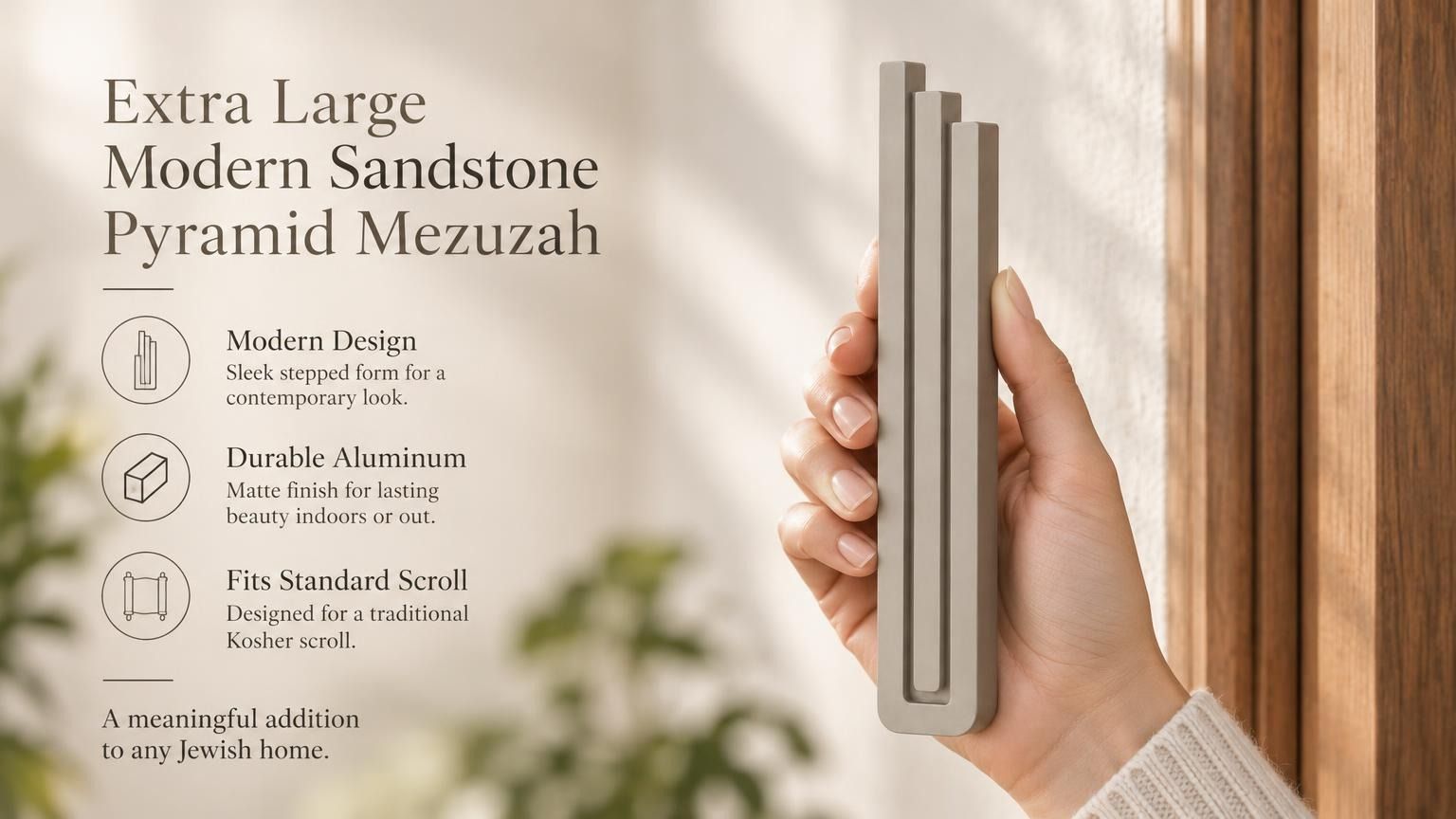 Extra Large Modern Sandstone Pyramid Mezuzah pictured in hand as a warm taupe sandstone aluminum mezuzah cover with three graduated bars and a minimalist stepped design, alongside its name and illustrated product features in a wide social-sharing image