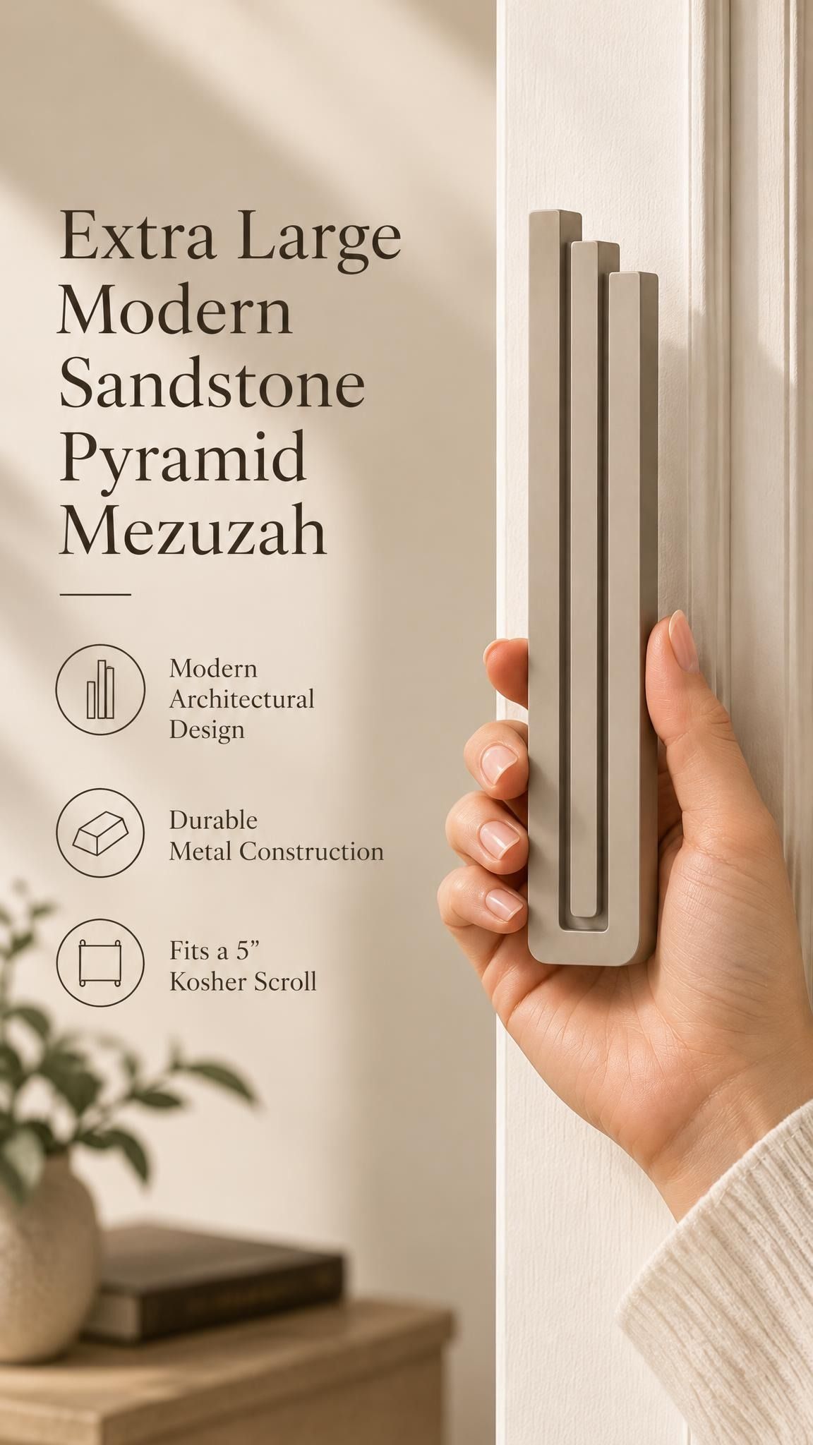 Hand holding the Extra Large Modern Sandstone Pyramid Mezuzah upright, revealing its warm taupe sandstone aluminum mezuzah cover, slender three-bar Pyramid design and graduated top beside illustrated product features for minimalist Jewish home Judaica