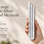 Extra Large Modern Silver Pyramid Mezuzah pictured in hand as a softly brushed silver aluminum mezuzah cover with three graduated bars and a minimalist stepped design, alongside its name and illustrated product features in a wide social-sharing image