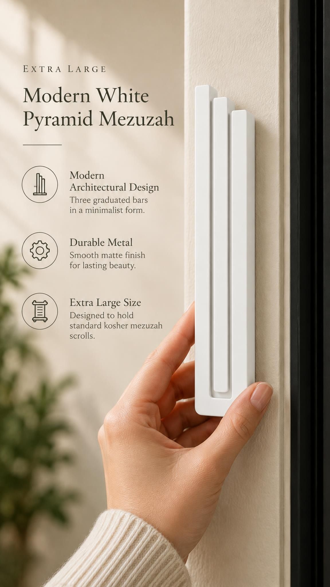 Extra Large Modern White Pyramid Mezuzah held beside a doorpost, with the smooth matte white aluminum mezuzah cover shown close enough to reveal its three stepped bars and rounded lower edge alongside product-name and design callouts for this contemporary Judaica piece