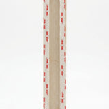 Back of an extra large sized Shaddai Ramparts Jerusalem stone mezuzah showing long recessed scroll chamber and included mounting tape