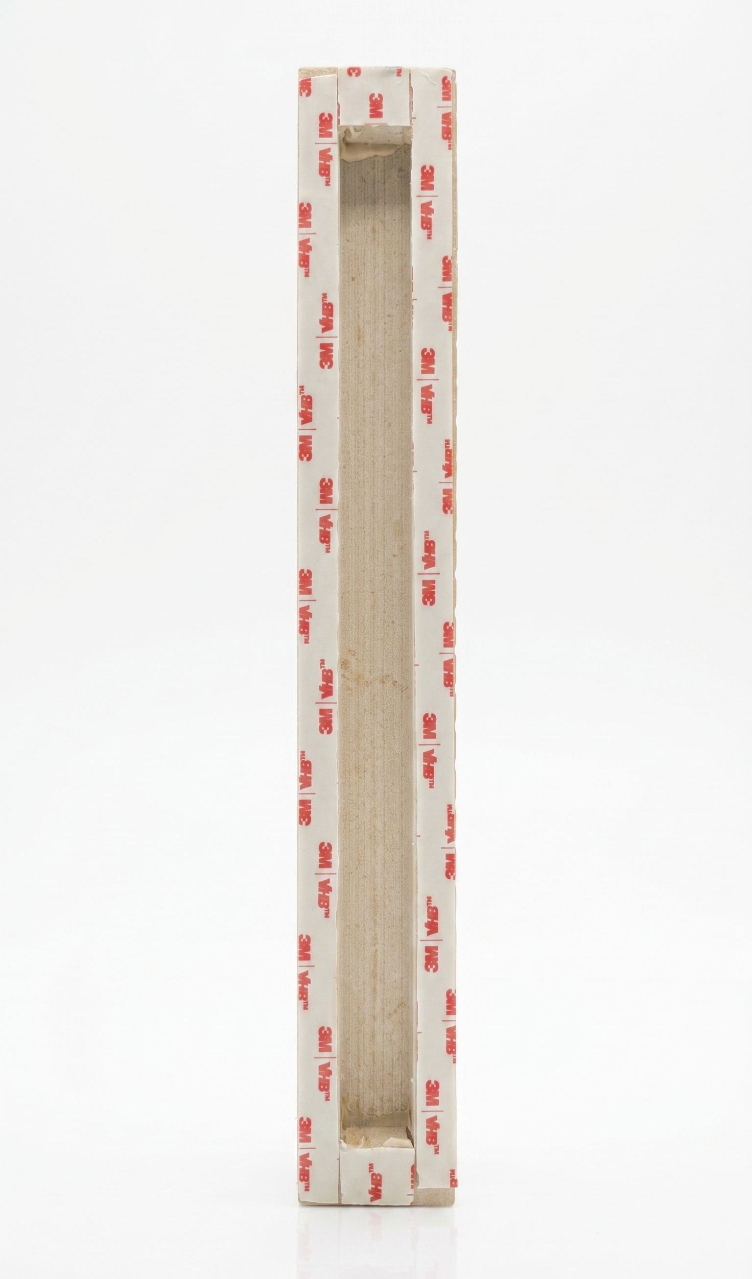 Back of an extra large sized Shaddai Ramparts Jerusalem stone mezuzah showing long recessed scroll chamber and included mounting tape