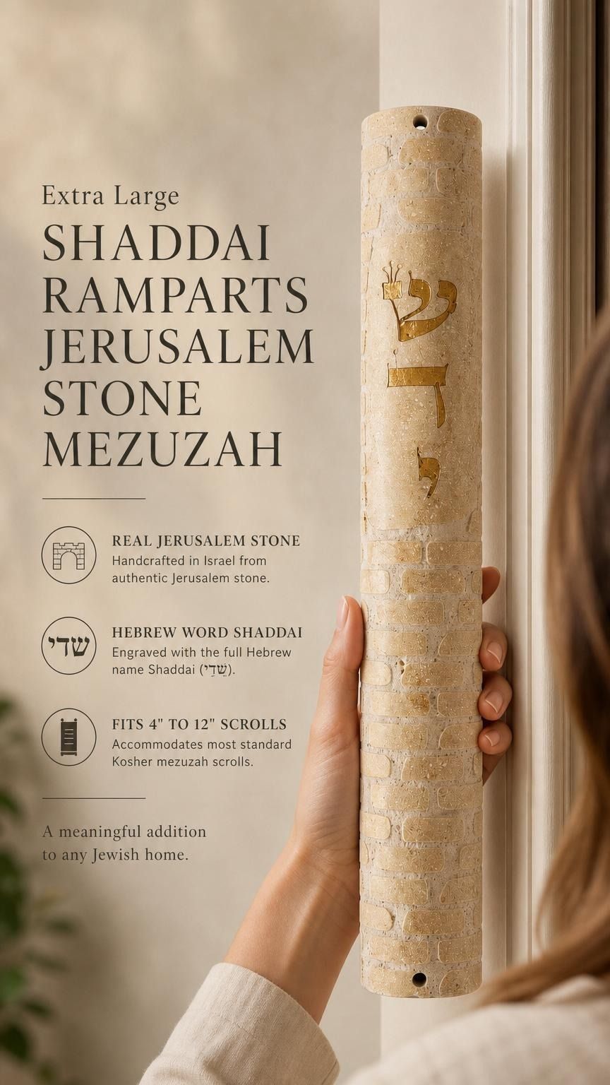 Hand-held view of the extra-large Shaddai Ramparts Jerusalem Stone Mezuzah showing its height, texture, Hebrew engravings, and gold lettering.