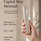 Capital Shin champagne mezuzah specification image highlighting the 5.5-inch body, 5-inch kosher scroll fit, Israeli origin, and bottom opening