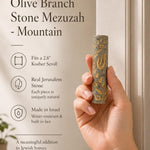 Female hand holding the real Jerusalem stone Mezuzah at realistic scale, showcasing its texture and material for store display.