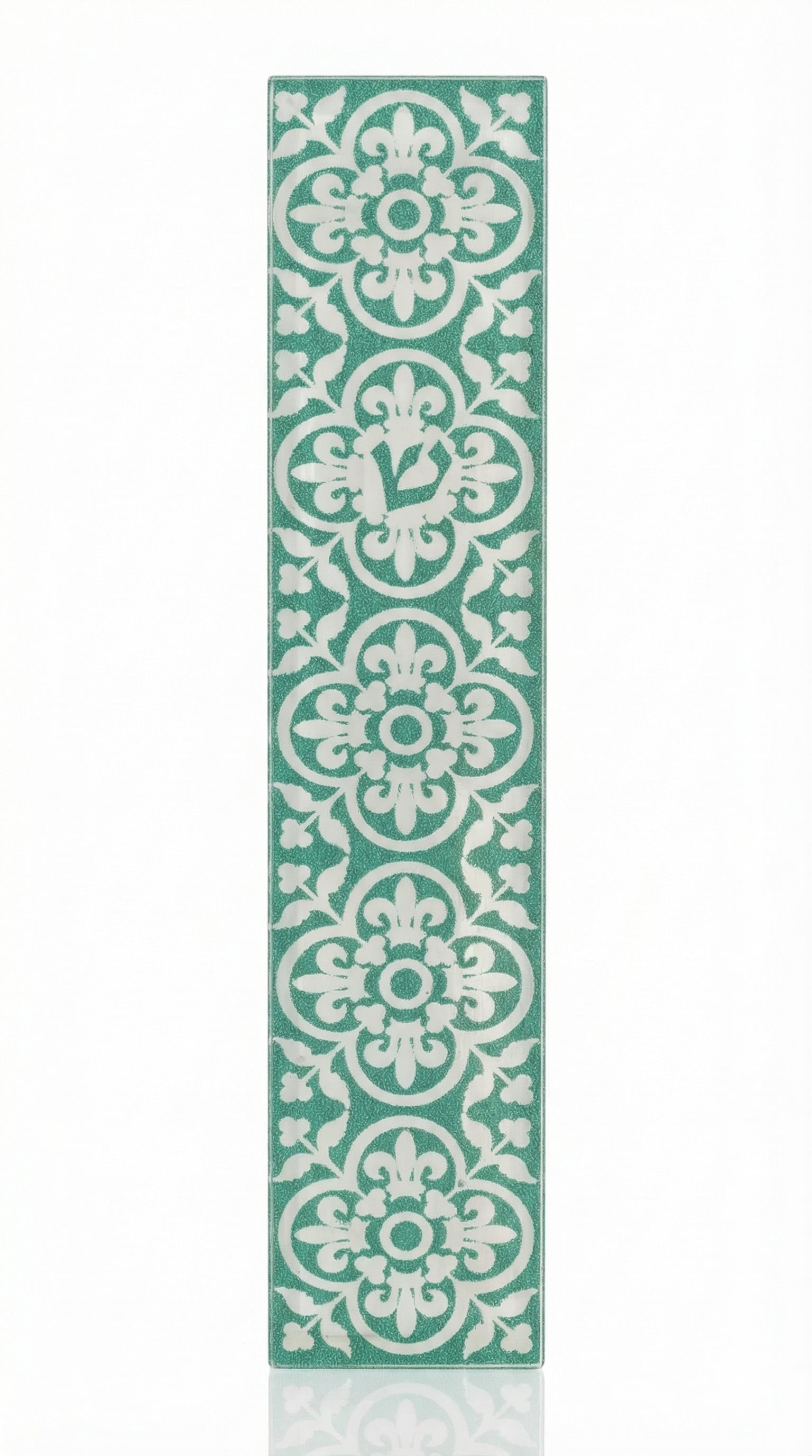 A detailed acrylic Fes Mezuzah with Hebrew inscriptions and decorative motifs, mounted vertically on a white background with a subtle reflection.