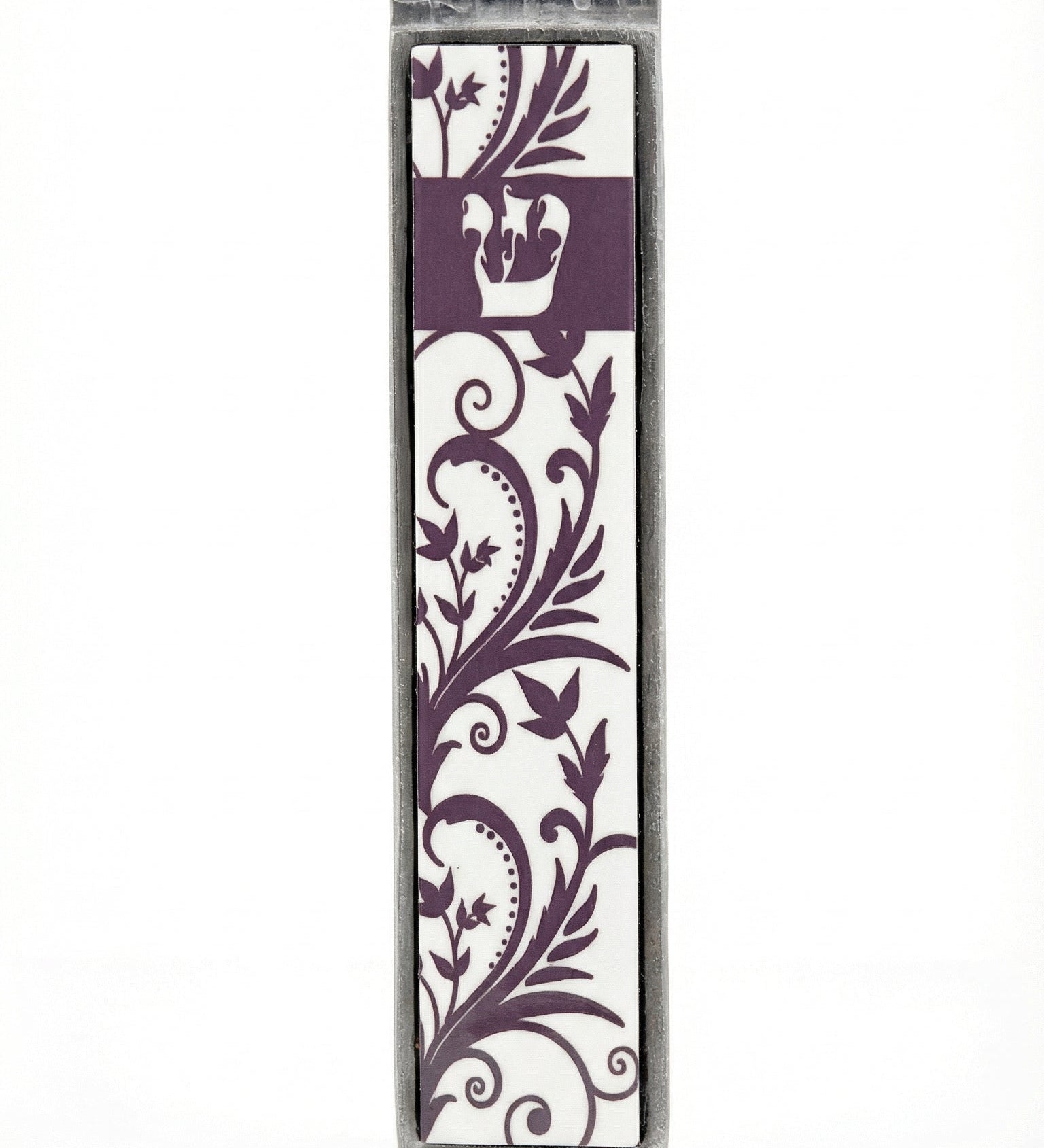 High-resolution image of a floral pewter and wood mezuzah with Shin detail, cream and purple tones, on a white studio surface with soft reflection.