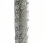 Handcrafted Jerusalem stone mezuzah with Hebrew inscriptions, detailed surface texture, and decorative motifs on a white background with soft reflection.